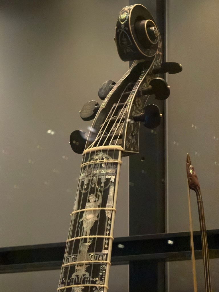 Martin Voigt (active Hamburg, early eighteenth century), Bass Viola da gamba, 1726. Ebony inlaid with engraved mother-of-pearl, ebony ribs with ivory stringing. Length 121 cm, body length 67 cm, string length 66.5 cm. Victoria and Albert Museum, London, on loan to the Horniman Museum, London